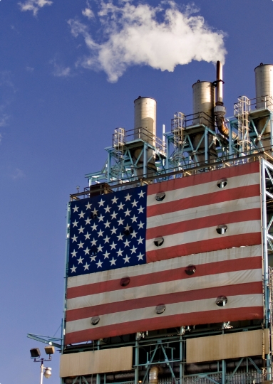 An American flag covering a carbon facility